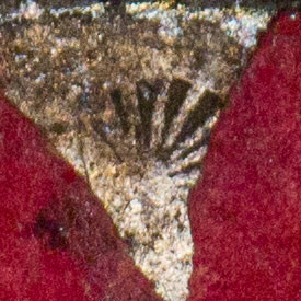 Small, partial sunburst chopmark