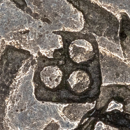 Four dots in a circle, possibly 田 - デン / た - rice field, rice paddy