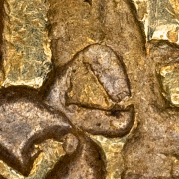 Small triangle shaped chopmark