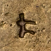 Possibly 仁 - ジン・ニ・ニン - humanity, virtue, benevolence, charity, man, kernel