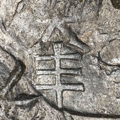 大丰 - dà fēng - great abundance (a common auspicious merchant or shop name) - 大 (dà, 'great') with 丰 (fēng, 'abundant, lush'; also the simplified form of 豐), so the mark reads as 'great abundance', a stock auspicious business name of the kind merchants chose for good fortune. As a chopmark it most likely identifies the silver shop or merchant house that tested the coin and accepted it as genuine silver.
