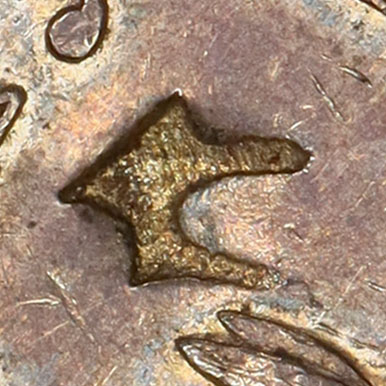 Possibly 仁 - rén - benevolence, humanity, kernel