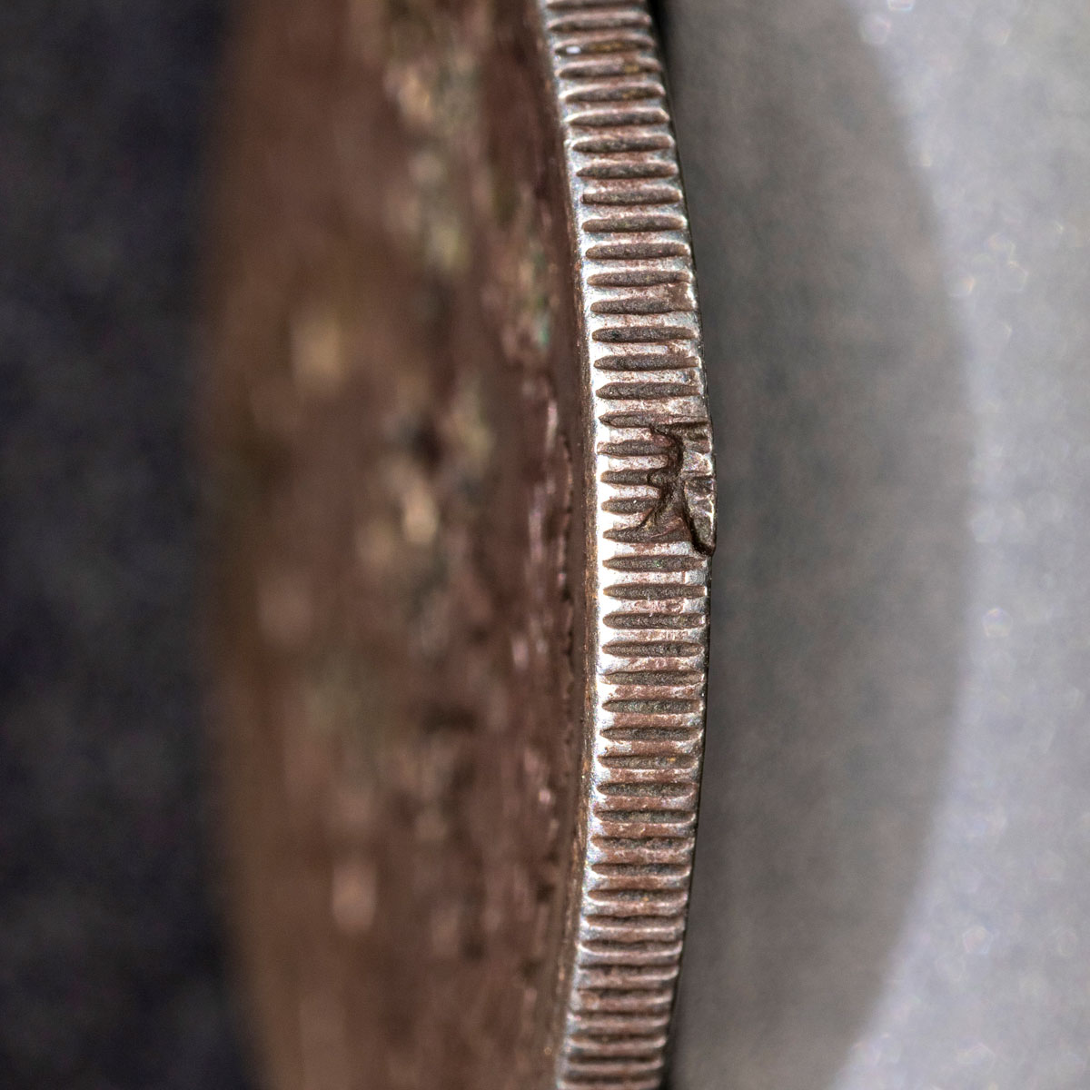 Chopmark on edge of coin
